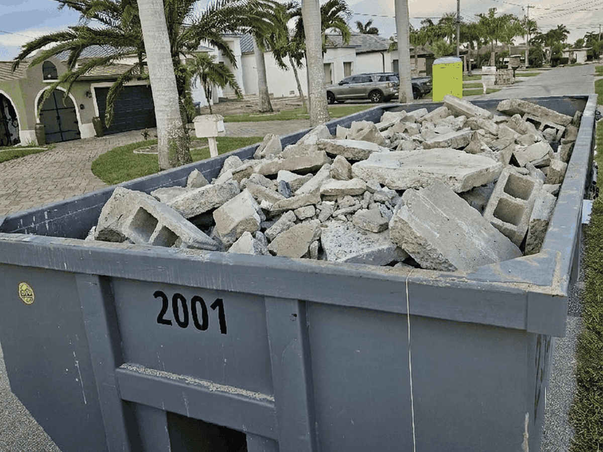 Roll-off dumpster loaded with clean broken concrete slab and block