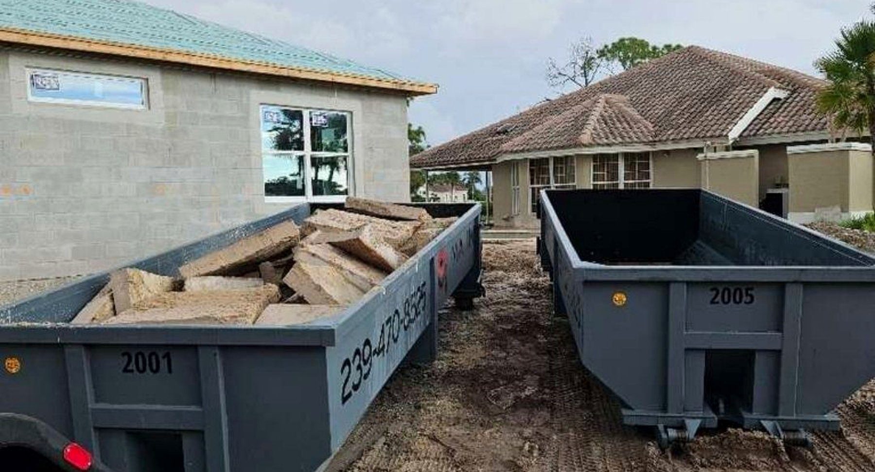 Two Maxim Disposal roll-off containers on an active new build jobsite in Southwest Florida