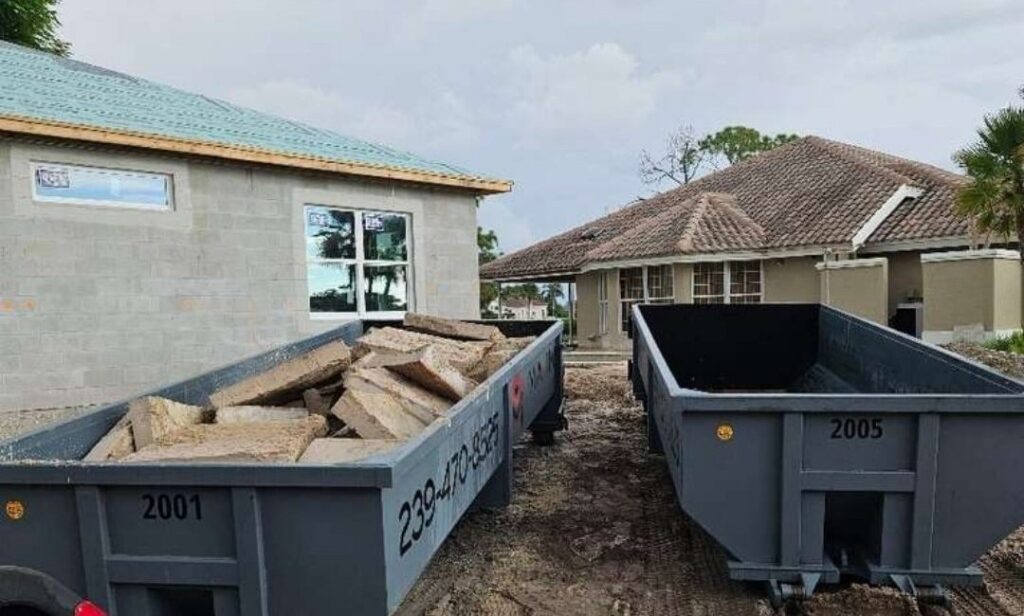 Two Maxim Disposal roll-off containers on one new construction site