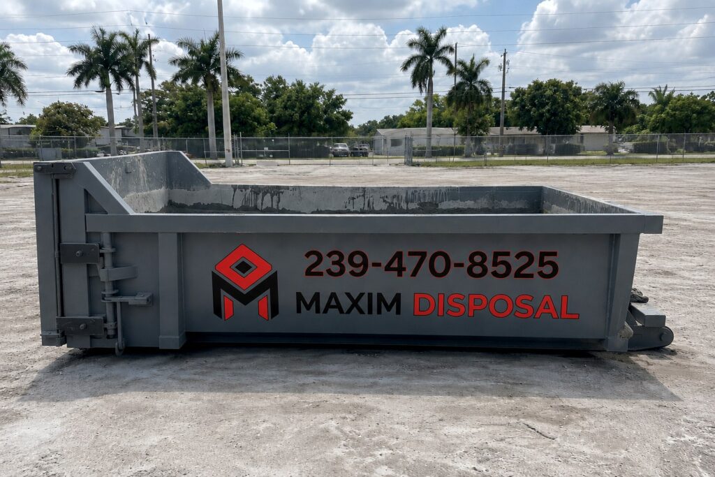 Maxim Disposal 6.5 yard concrete washout container, side view showing dried concrete on the interior walls
